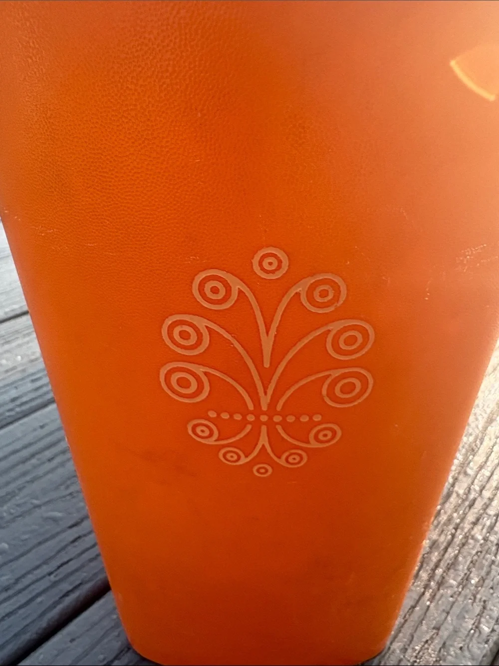 Tupperware Orange Storage Container with Decorative Emblem